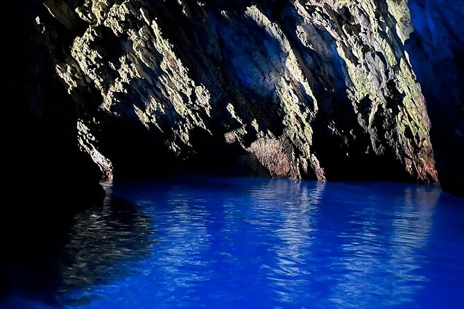 Blue Cave & Island Escape: A Unique 6-Island Adventure from Split - Ravnik Island and the Green Cave pass: cool color from the outside