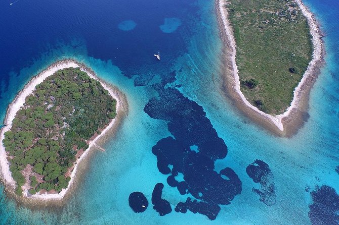 Blue Lagoon and Trogir Half-Day Speedboat Tour from Split - Stop One: Blue Lagoon (Krknjaši Bay) for turquoise water and mask snorkeling
