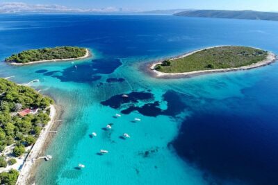 Blue Lagoon, Trogir & Čiovo catamaran tour with Food and Drinks - Stop 1: Blue Lagoon / Krknjasi Bay swim stop (plus fresh fruit)