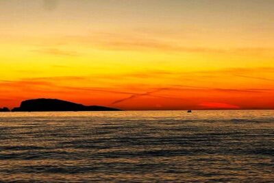 Cavtat Sunset Escape Romantic Cruise and Free Flowing Drinks - Passing Supetar Island: Quiet Water, Rocky Shoreline, Wild Feel