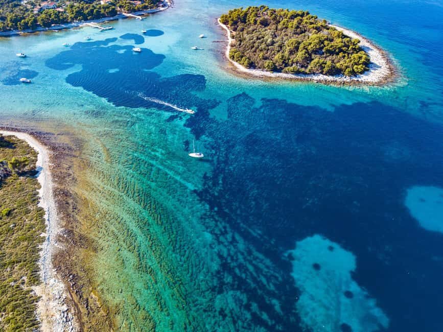 From Split: Blue Lagoon & Underwater Museum (Lunch & drinks) - The resort beach between swims: where your day stays comfortable