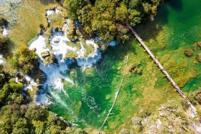 From Split: Krka Waterfalls Trip with Boat Cruise and Swimming - Primosten Beach Time (Most Months) or Trogir Old Town (April–Early May)