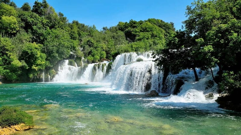 From Split: Krka Waterfalls with Riverboat Ride & swimm stop - The riverboat ride: the canyon view you can’t fake