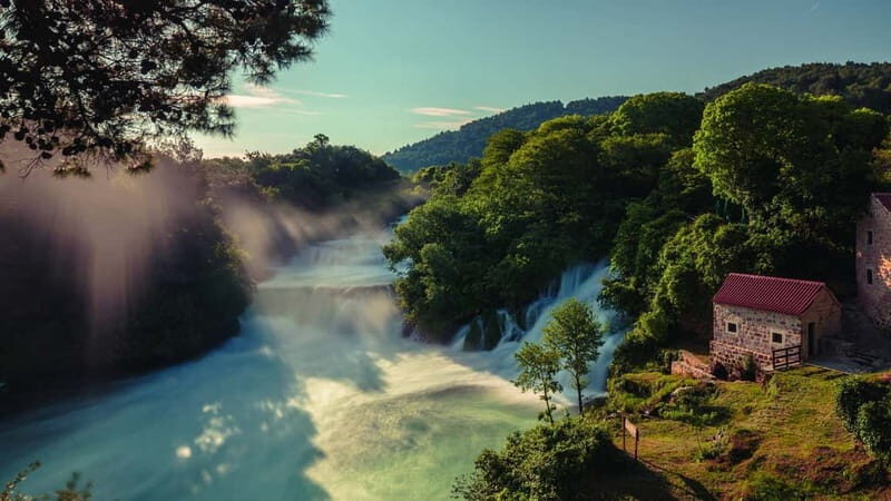 From Split: Krka Waterfalls with Riverboat Ride & swimm stop - Guided Krka highlights: watermill, Etno village, and the main falls