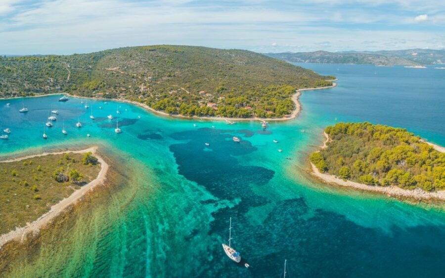 From Split: Trogir & Blue Lagoon Boat Tour with Snorkeling - Ciovo Bay pine forests and pebble beaches: the views are part of the point