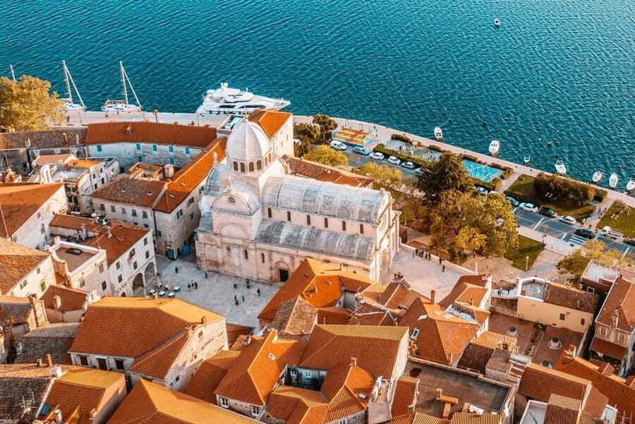 From Trogir, Seget & Okrug: Krka Waterfalls Culture Tour - Primošten Seaside Finish: Medieval Streets and a Swim-Worthy Window