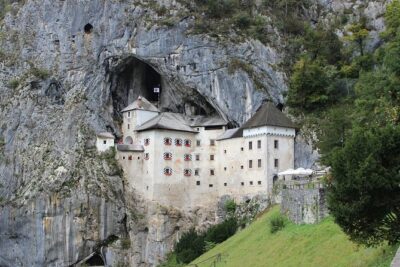 From Zagreb: POSTOJNA cave + Predjama castle + LJUBLJANA Day Tour - Predjama Castle: A Cave Fortress That Feels Like Movie Magic