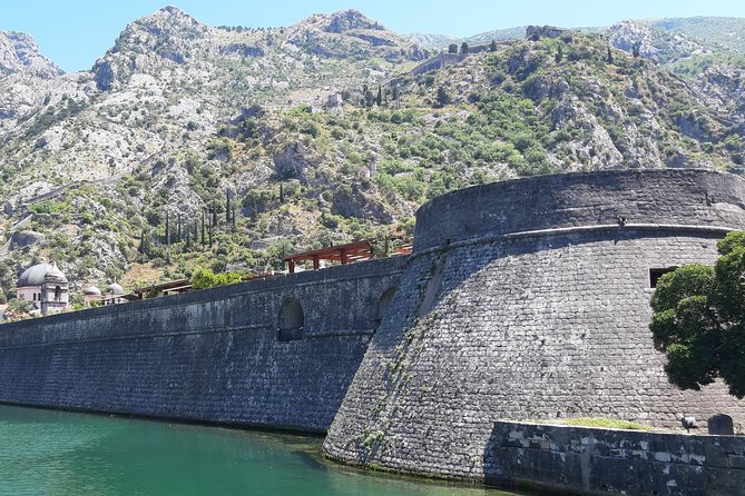 Full-Day Tour Bay of Kotor Perast Kotor and Budva small group from Dubrovnik - Kotor old town: fortress streets, cathedral area, and the entry tax