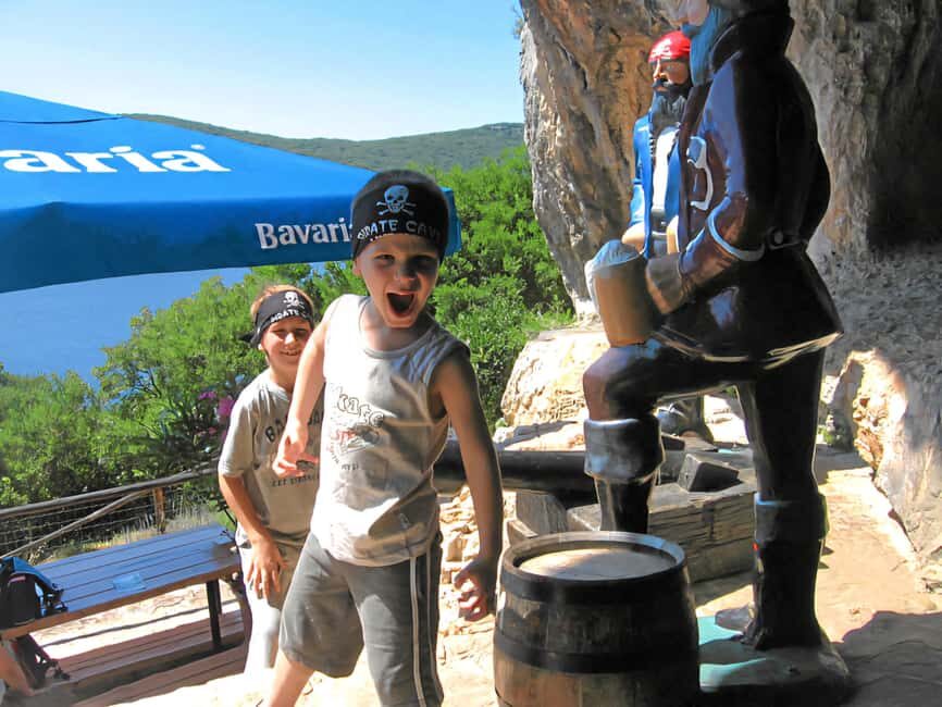 Funtana: Lim Fjord Cruise to Pirate’s Cave with Snorkeling - Board life: music, shaded deck, life jackets, and free drinks