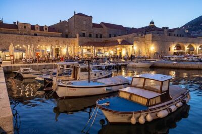 Golden hour SUNSET CRUISE from Dubrovnik Old Town - Stop 1: Dubrovnik Old Town from the sea (walls, rooftops, fortifications)