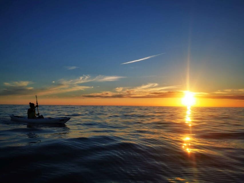 Poreč: Sea Kayaking Sunset Tour - Sunset on the Water: Clouds, Horizons, and Dolphin Chances