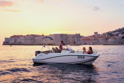 Private Sunset boat tour - Stop 1: Dubrovnik City Walls at sunset from the water