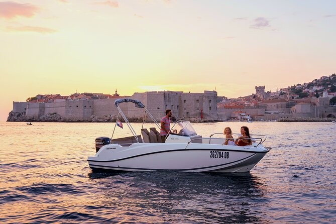 Private Sunset boat tour - Stop 1: Dubrovnik City Walls at sunset from the water