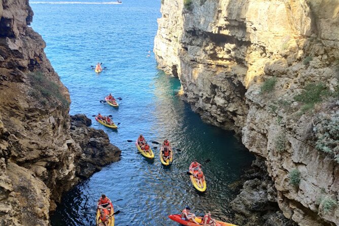 Pula: Cave Kayak Tour and Snorkeling - Inside the sea cave: pigeons, echoes, and that quiet stop