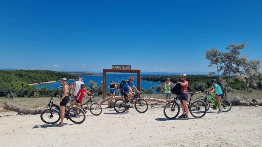 Pula: Kamenjak Bike Tour with Blue Cave and Cliffs Visit - Finding the Blue Cave area from land, not by tour bus