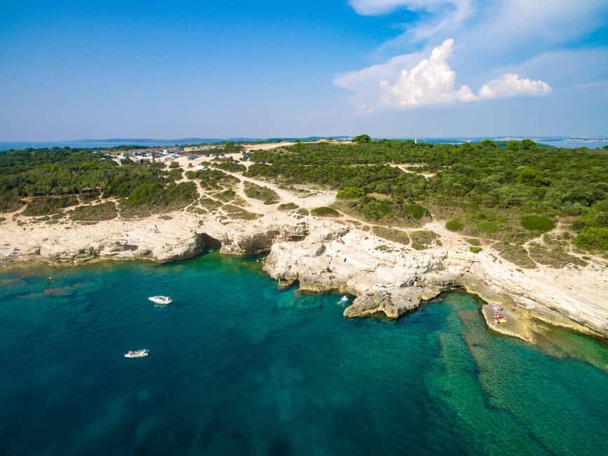 Pula: Kamenjak Bike Tour with Blue Cave and Cliffs Visit - Bike rental, helmets, and guide quality: where your $57 goes