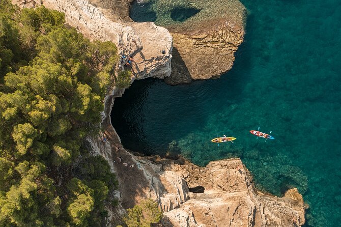 Pula Kayaking Cave, Islands and Cliffs Tour with drinks - A 3-hour kayak hit of Pula’s coast: what you actually do