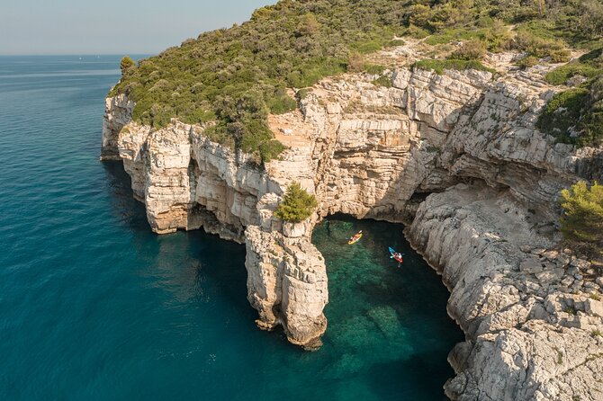 Pula Kayaking Cave, Islands and Cliffs Tour with drinks - Language, guide style, and how it works with mixed groups