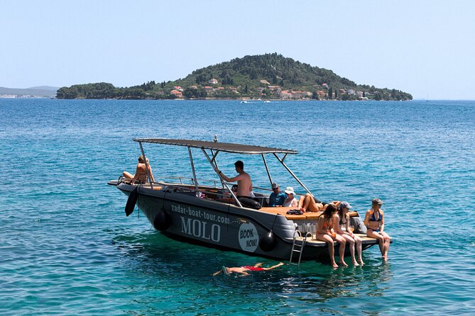 Zadar: 3 Islands Luxury Boat Tour with Aperol Spritz & Snorkeling - Stop 3 near Ugljan and Skoljic: the mix of history hints and swimming