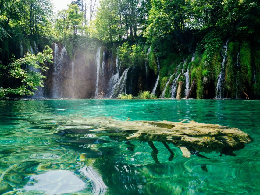 Zadar: Plitvice Lakes Guided Day Tour with Tickets - Electric train and boat rides: the smart shortcut through Plitvice