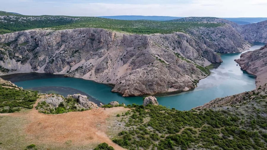 Zadar: Private Velebit Mountains & Zrmanja Canyon Photo Tour - Maslenica Bridge: the first big panoramic frame over the sea