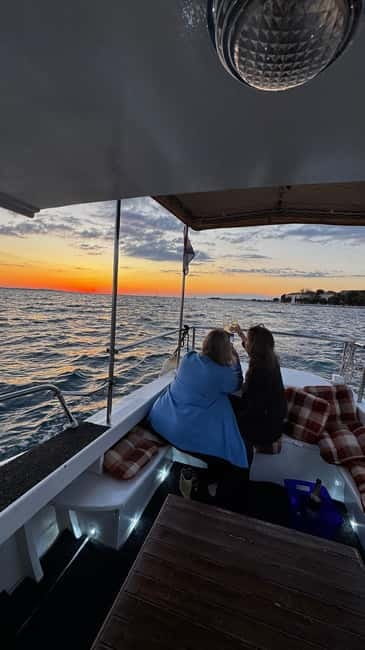 Zadar: Sunset boat tour with champagne - Cruising past Zadar’s old town walls while the sky turns romantic